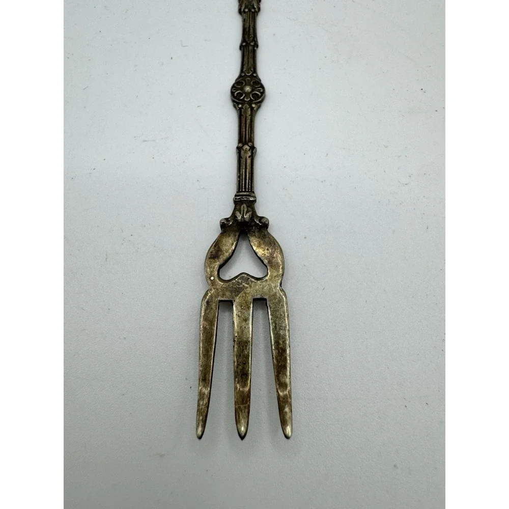 Ornate Italian souvenir fork with a lion rampant and crown motif